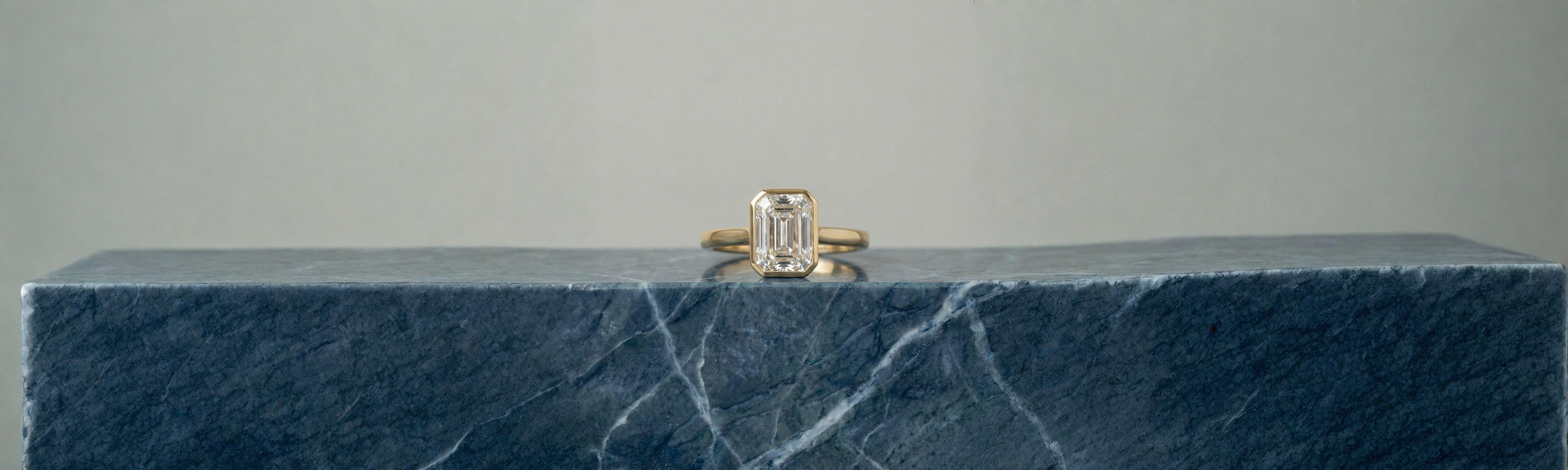 Emerald Cut Bezel Engagement Ring in 18k Yellow Gold