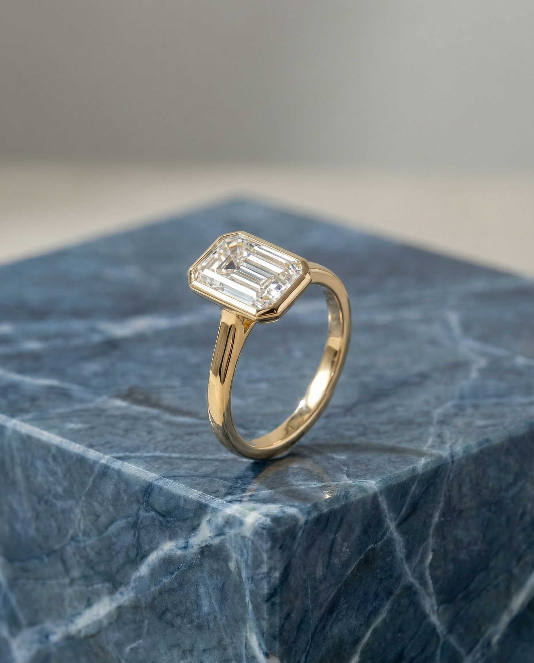 Emerald Cut Engagement Ring in 18k Yellow Gold with Bezel